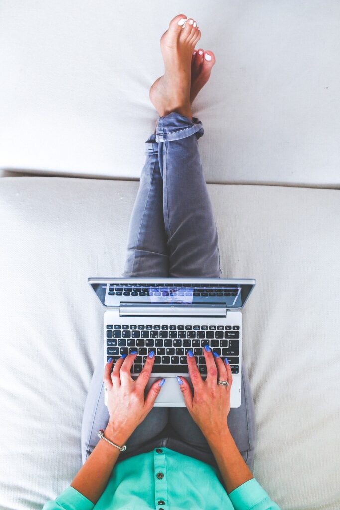 Woman typing on a computer